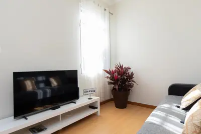 a living room with a large flat screen tv at Casa da Jackie by Rent-a-key in Funchal