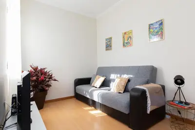 a living room with a couch and a tv at Casa da Jackie by Rent-a-key in Funchal