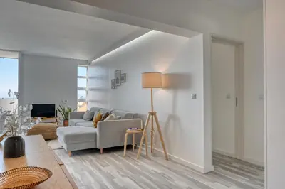 a living room with a couch and a table at Maranta House, a Home in Madeira in Funchal