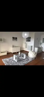 a living room with a couch and a coffee table at O lagar in Câmara de Lobos