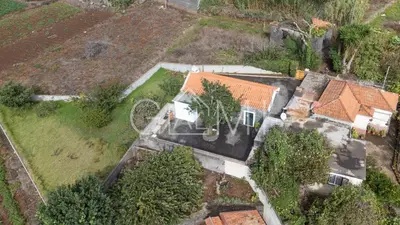 an overhead view of a house with trees in a field at Casa do Maurício by GALMI in Ponta do Pargo
