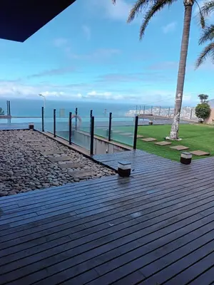 an empty hallway of a building with a view of a room at Super luxury villa Views and panoramic lift in Funchal