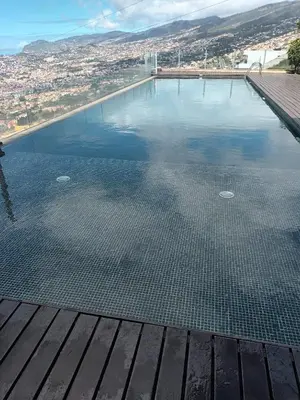 a white bathroom with a toilet and a sink at Super luxury villa Views and panoramic lift in Funchal