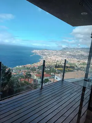 a ping pong table in front of a staircase at Super luxury villa Views and panoramic lift in Funchal