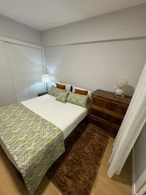 a small bedroom with a bed and a dresser at Infante Home in Funchal