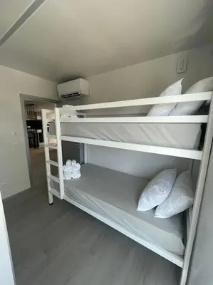 a room with two bunk beds with pillows at Luxurious T2 Varandas Apartment XIII in Funchal