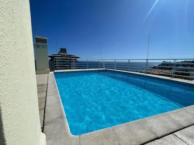 a swimming pool on the roof of a building at Luxurious T2 Varandas Apartment XIII in Funchal