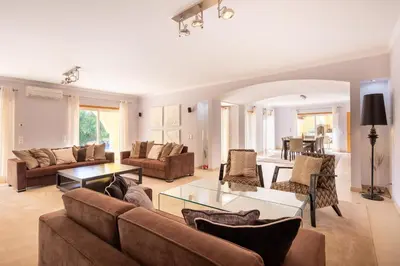 a living room with a couch and a table at Casa Amarela in Lagos