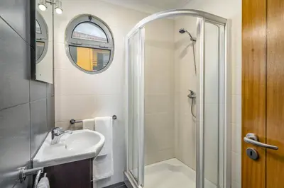 a bathroom with a shower and a sink at Villa Atlantic Sunset by Villa Plus in Funchal