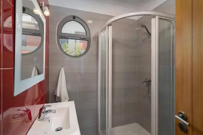 a bathroom with a shower and a sink at Villa Atlantic Sunrise by Villa Plus in Funchal