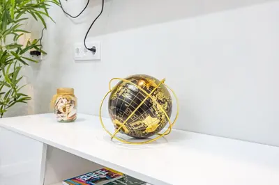 a globe on a shelf in a room at Magalhães AL by YOUR KEY MADEIRA in Machico