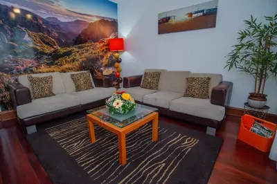 a living room with two couches and a coffee table at Countesses Villa in Câmara de Lobos