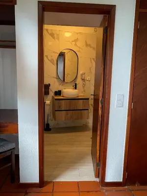 a bathroom with a sink and a mirror at Habitación santo antonio in Estrela