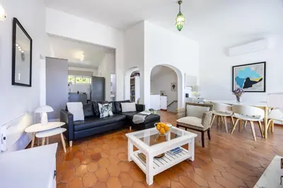 a living room with a couch and a fireplace at CoolHouses Algarve Luz,3 bed townhouse, lovely sea view, walking distance to beach, Casa 24 LBC in Luz