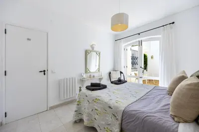an outdoor stairway with potted plants and flowers at CoolHouses Algarve Luz,3 bed townhouse, lovely sea view, walking distance to beach, Casa 24 LBC in Luz