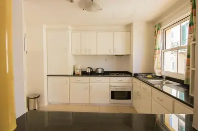 a hotel room with two beds and a window at Apartamentos Turisticos Avenue Park in Funchal
