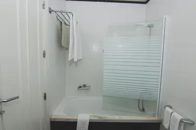 a bedroom with a bed in a room at Apartamentos Turisticos Avenue Park in Funchal