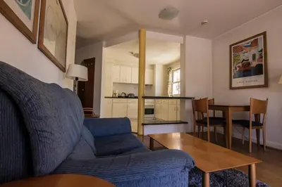 a bathroom with a sink and a phone on the wall at Apartamentos Turisticos Avenue Park in Funchal