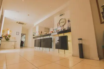 a kitchen with a table and chairs in a room at Apartamentos Turisticos Avenue Park in Funchal