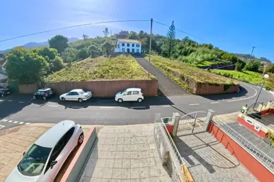 a view of a parking lot with cars parked at Zezita's Place in São Jorge