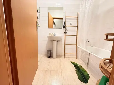 a bathroom with a sink and a toilet and a tub at Zezita's Place in São Jorge