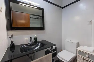 a bathroom with a sink and a toilet at Formosa Beach Apartment Vista Mar a 2 Minutos da Praia in Funchal