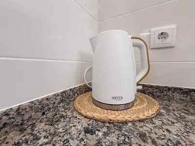 a white coffee maker sitting on a counter at Funchal Bartolomeu Explorers in Funchal