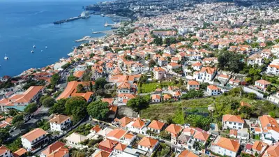an aerial view of a city with a yellow arrow on it at Funchal Bartolomeu Explorers in Funchal