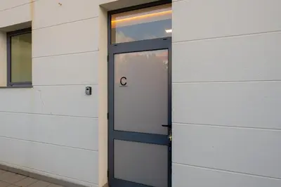 a door in the side of a building at VIP Baía Beach C in Machico