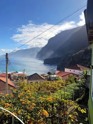 a town with a view of the ocean and mountains at Casa Vintage Seixal Madeira in Seixal