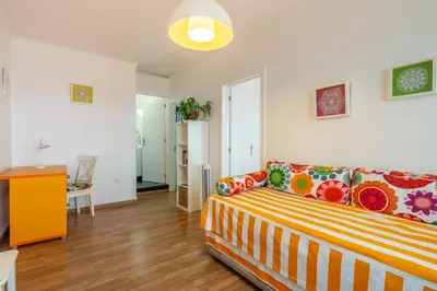 a living room with a couch and a table at Campo & Mar Apartments in Porto Moniz