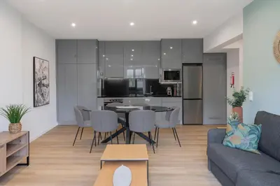 a living room with a couch and a table at Atlantic Blue 2 - central and with garage in Funchal