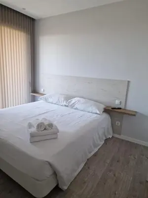 a bedroom with a bed with two towels on it at Ocean Paradise de Santa Luzia in Funchal