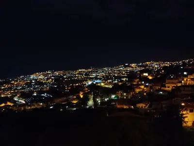 a view of a city lit up at night at Ocean Paradise de Santa Luzia in Funchal