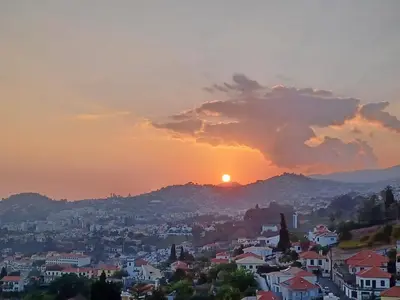 a view of a city at sunset at Ocean Paradise de Santa Luzia in Funchal