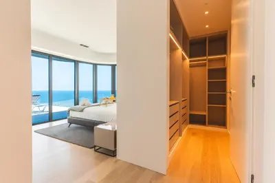 a bedroom with a bed and a view of the ocean at Majestic Penthouse View by Atlantic Holiday in Funchal