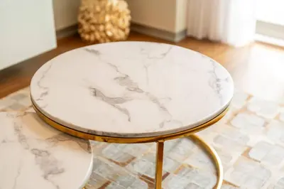 a white marble table with gold legs in a room at La Vie Funchal - City Center & Free Park in Funchal