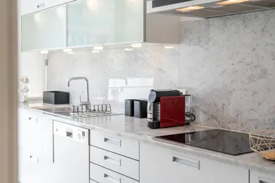 a kitchen with a counter top with a coffee maker at La Vie Funchal - City Center & Free Park in Funchal