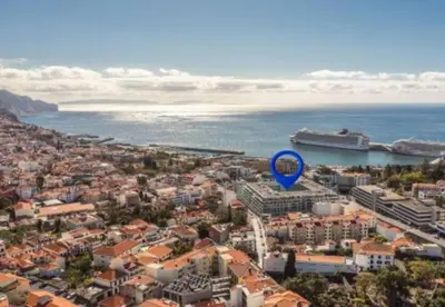 a blue marker sitting on top of a city at La Vie Funchal - City Center & Free Park in Funchal