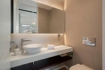 a bathroom with a bowl sink and a mirror at Maravilhas II by An Island Apart in Funchal