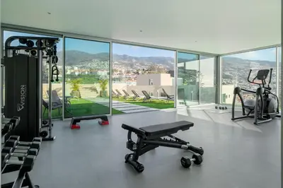 a gym with a view of a city at Maravilhas II by An Island Apart in Funchal