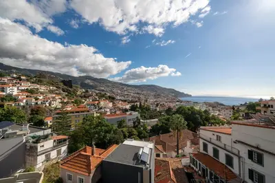 a view of a city with buildings and the ocean at Maravilhas II by An Island Apart in Funchal