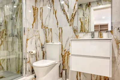 a bathroom with a toilet and a shower at BSE15 Apartments 1C, a Home in Madeira in Funchal