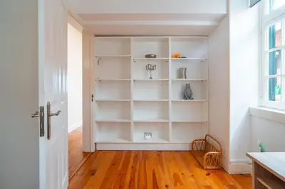 a room with white shelves and a door at Villa Oasis Sea View - 3 Bedrooms in Funchal