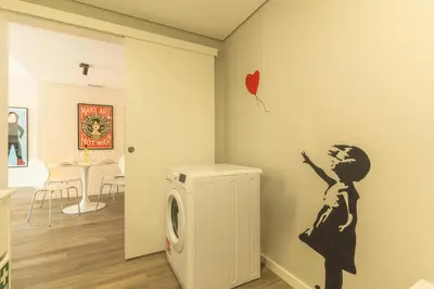 a laundry room with a washer and dryer at Art Studio by Atlantic Holiday in Funchal