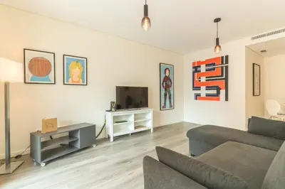 a living room with a couch and a tv at Art Studio by Atlantic Holiday in Funchal