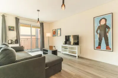 a living room with a couch and a tv at Art Studio by Atlantic Holiday in Funchal