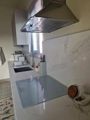 a kitchen with a sink and a counter top at Favinha Rooftop in Machico