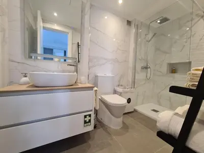 a bathroom with a sink and a toilet and a shower at Step To The Sea 4, by Pausa Holiday Rentals in Funchal