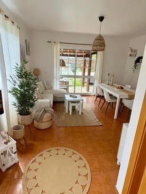 a living room with a couch and a table at Oliveira's Home in Porto Santo